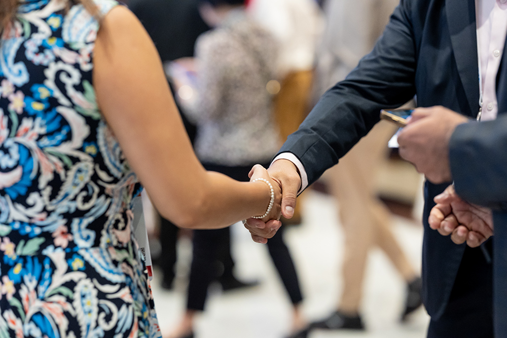 IFEAT Members shaking hands